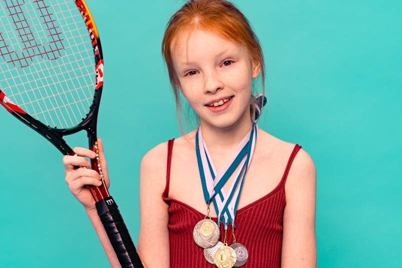 Young Girl with Wilson Junior Tennis Racket
